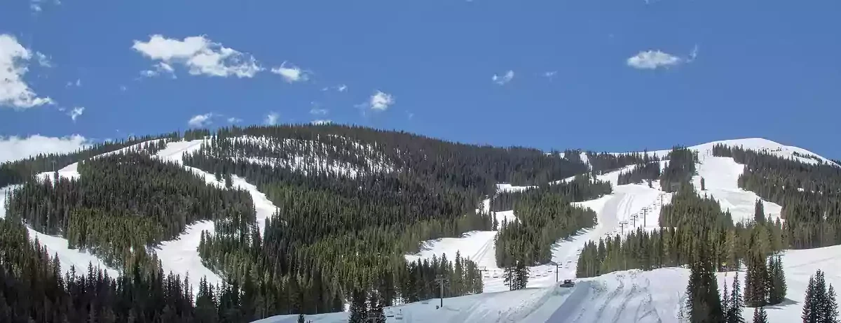 Snow covered slopes under sunshine at Copper Mountain, CO